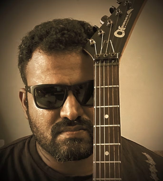 Dr. Sai Kiran Kumar with guitar