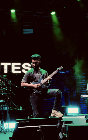 Guitarist performing with The Levites