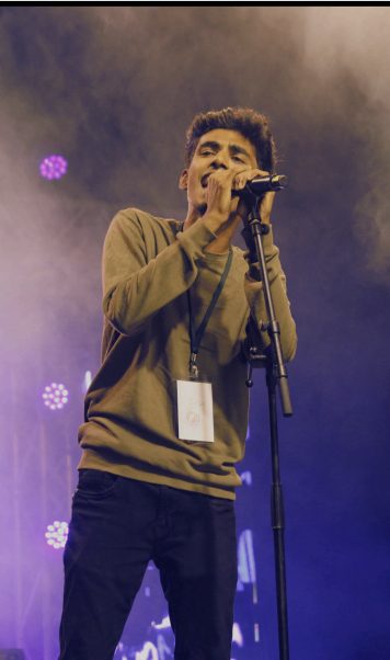 Vocalist performing with The Levites
