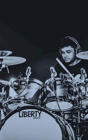 Drummer performing with The Levites