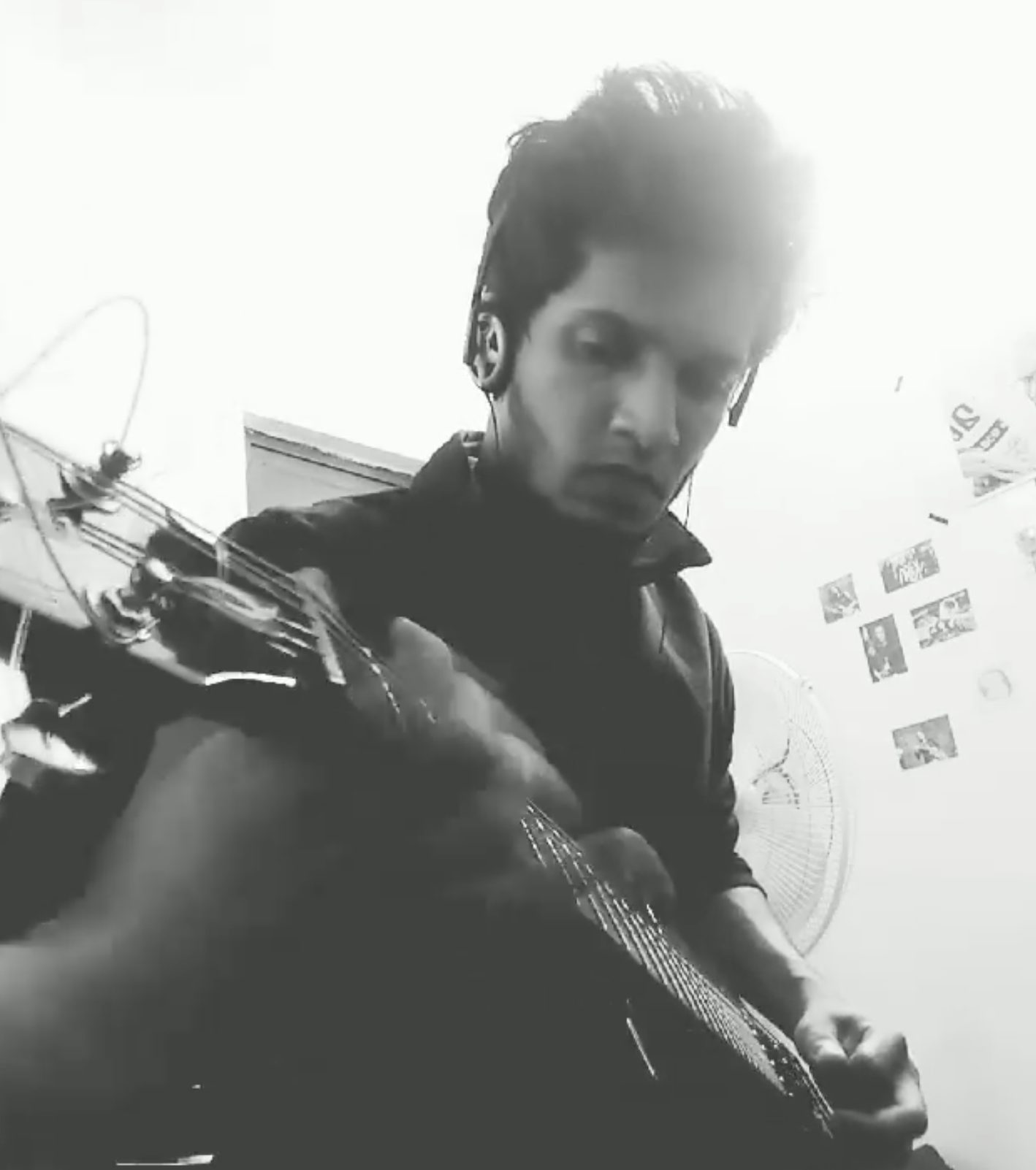 Vamsi Nath practicing acoustic guitar