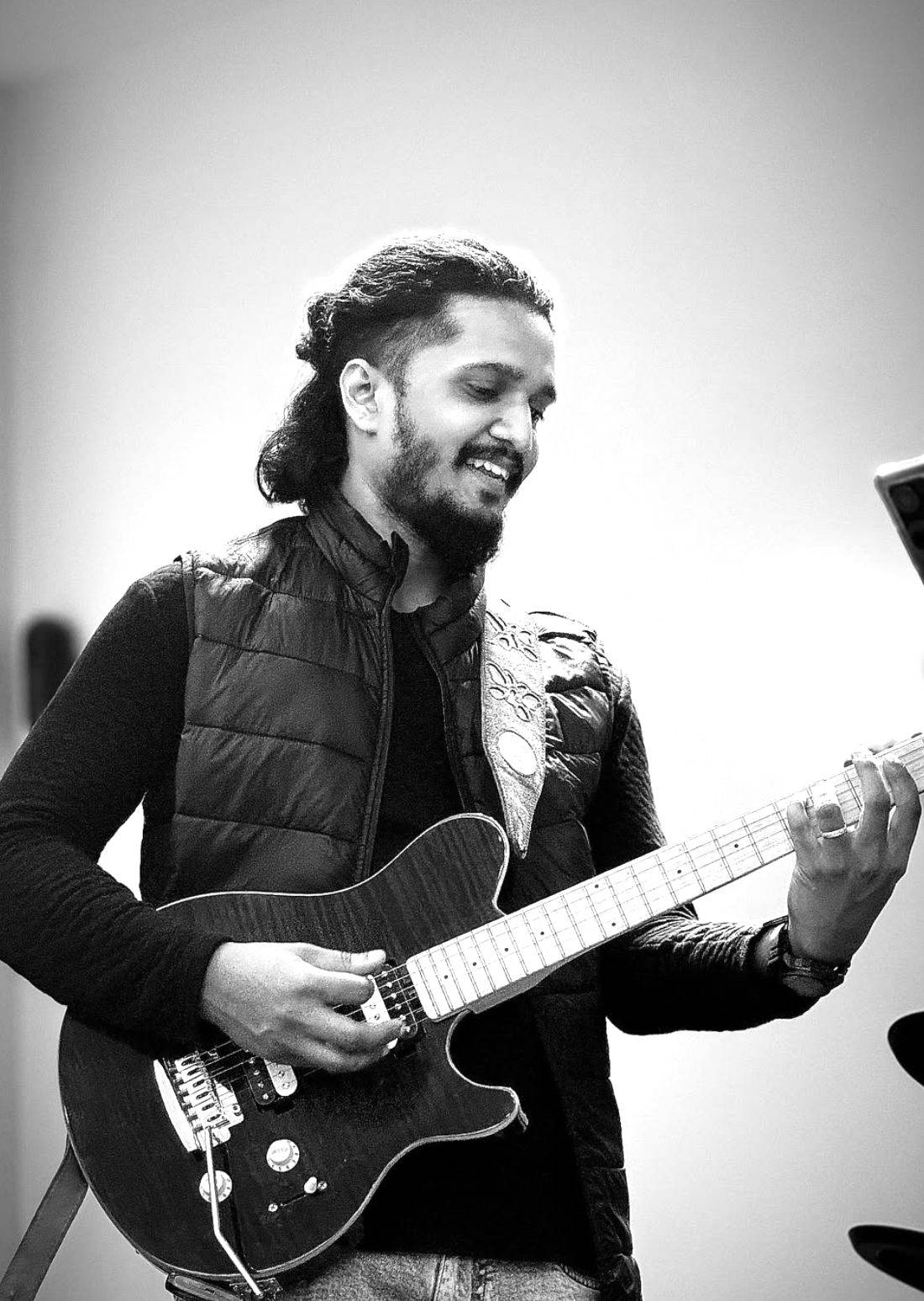 Vamsi Nath smiling while playing