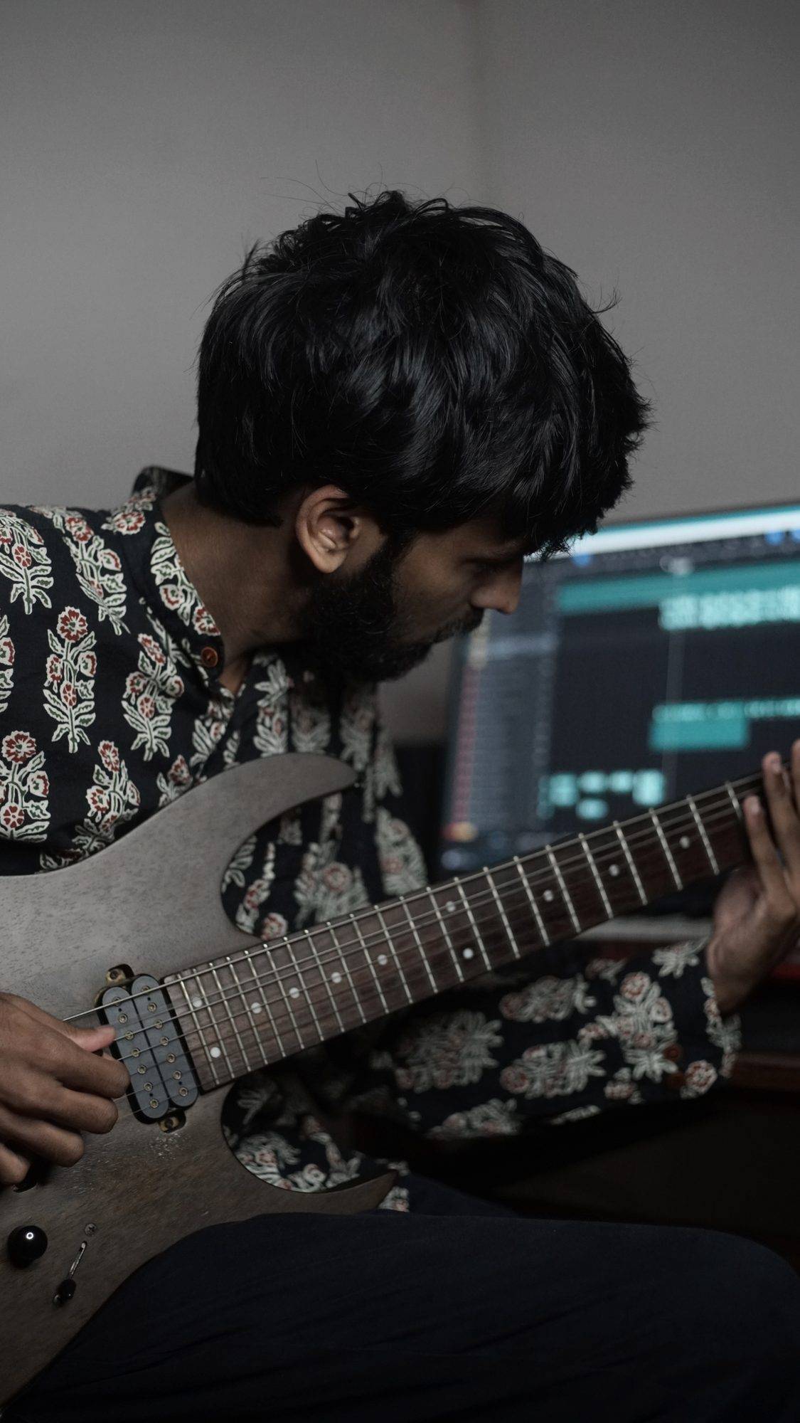 Sreeram Vijay recording guitar in his home studio