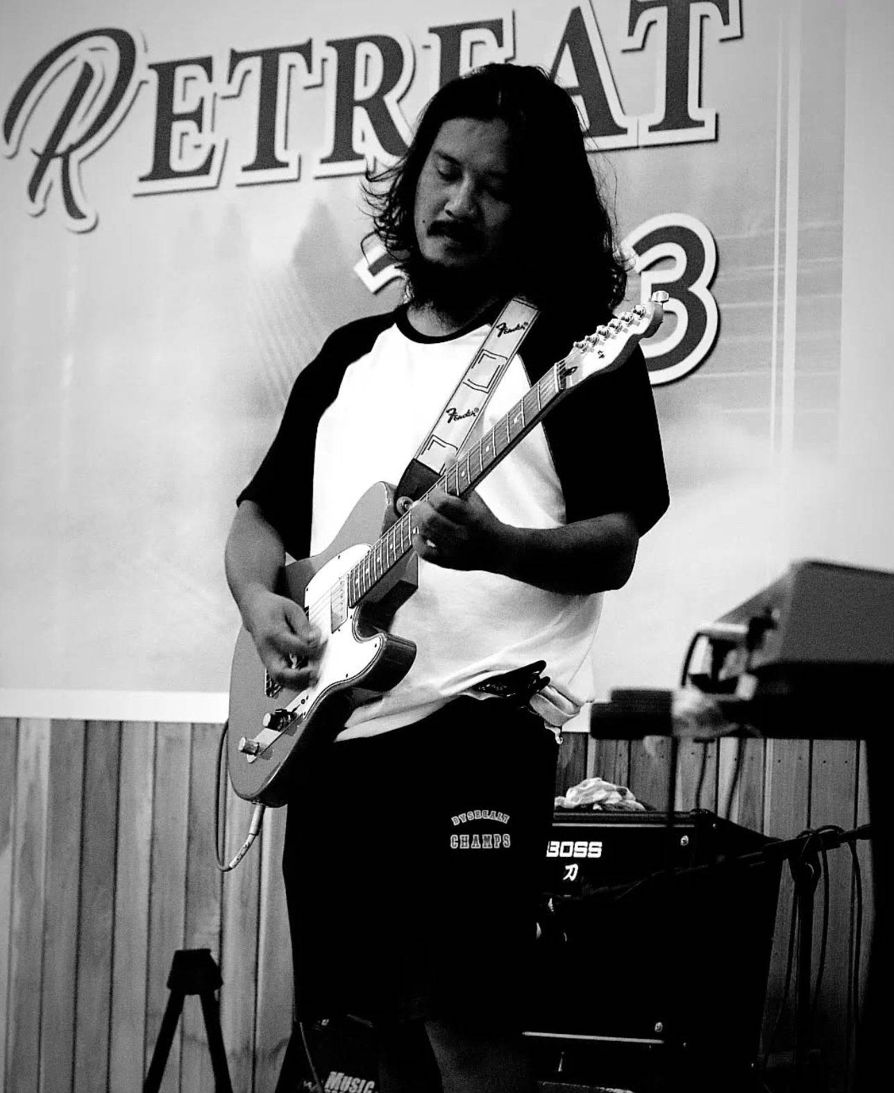Temjen Longkumer playing a Telecaster in black and white